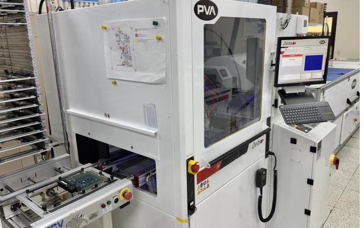 Automated conformal coating cell with a board in process