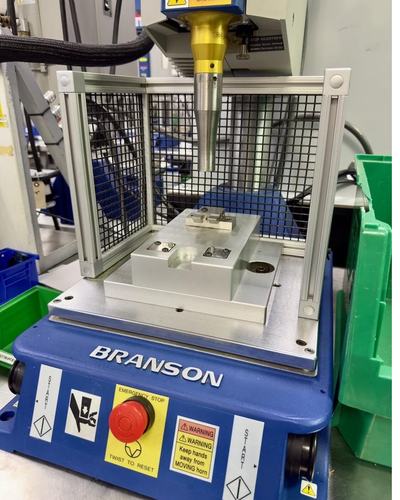 Branson ultrasonic welder with a part fixtured under the horn